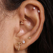 Load image into Gallery viewer, Tommi Statement Bow piercing yellow gold